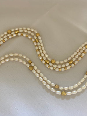  a seme con perle di acqua dolce von chiusura in argento placcato oro