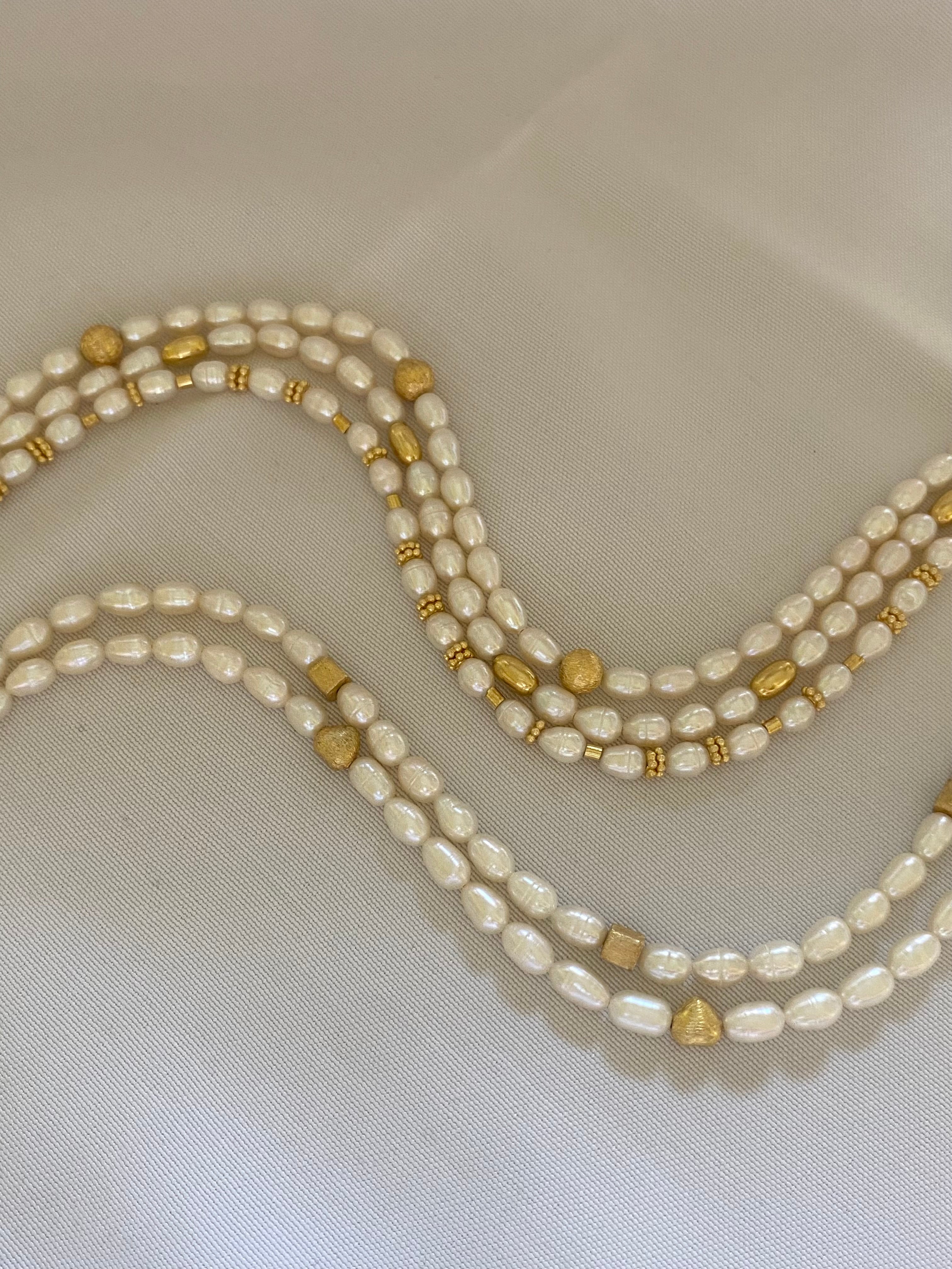  a seme con perle di acqua dolce von chiusura in argento placcato oro
